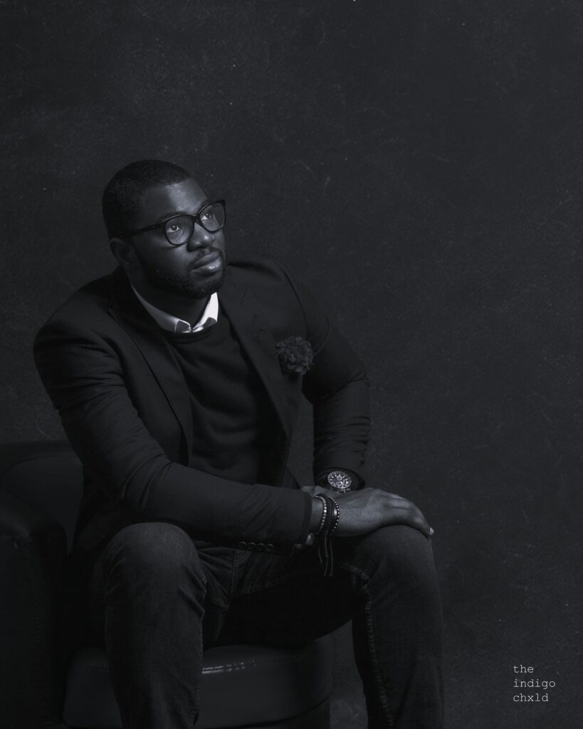 Abraham Ologundudu, portrait on a dark ground