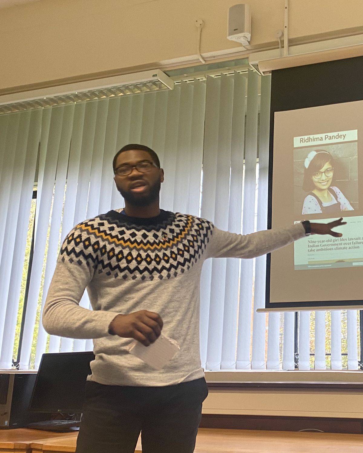 Abraham Ologundudu presenting at a screen